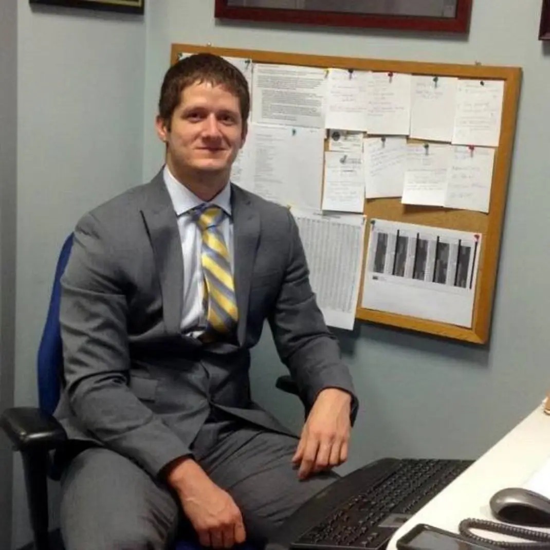 Michael Wimberley seated at a desk